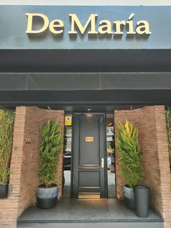 De María